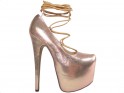 Golden tied pins on a high heels platform - 1