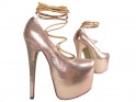 Golden tied pins on a high heels platform - 4