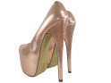Golden high heels pins on the platform - 4