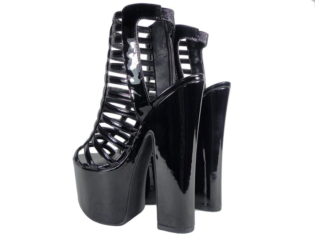 Black sandals on a shoe pole on a platform - 4