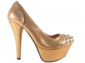 Shoes on a platform with spiked golden shuttles - 1