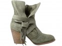 Green suede women's boots on a pole - 1