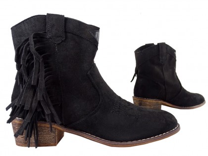 Black suede women's boots on a brick - 4