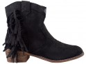 Black suede women's boots on a brick - 1