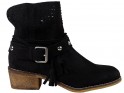 Black women's suede boots on a brick - 1