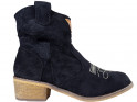 Black suede women's boots on a brick - 1