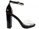 Black women's ankle strap sandals on a bar - 1