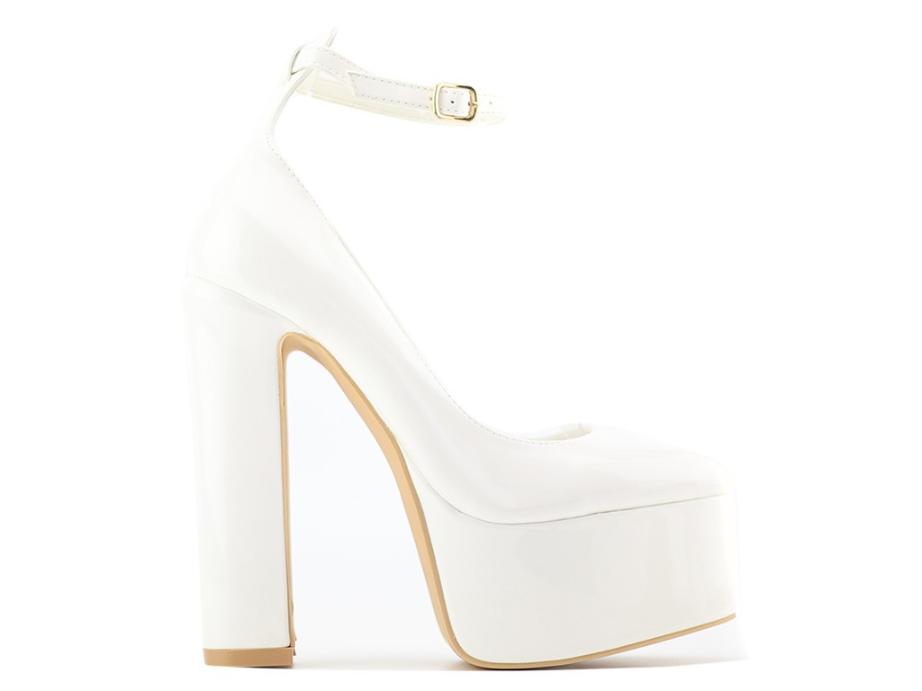 White platform shoes on a post with a strap - 1